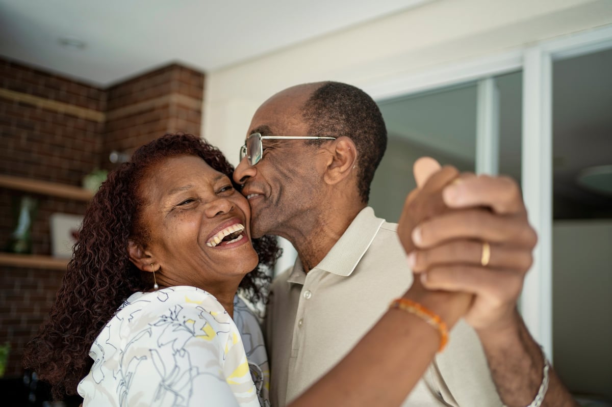 Happy older African American couple smiling and embracing, reflecting the patients KidneyCare serves